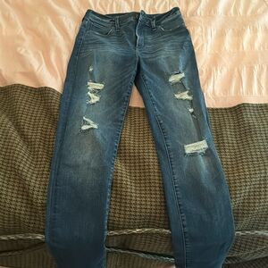 High-rise, distressed skinny Jean